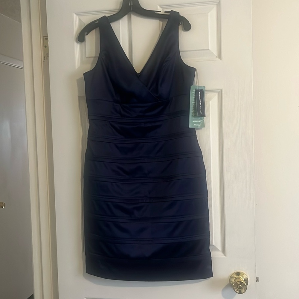 A American Living cocktail dress. It’s Royal Blue size 12 and brand new..